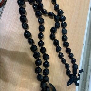 Sleek Black Stone Necklace with Glossy Finish and Spherical Beads